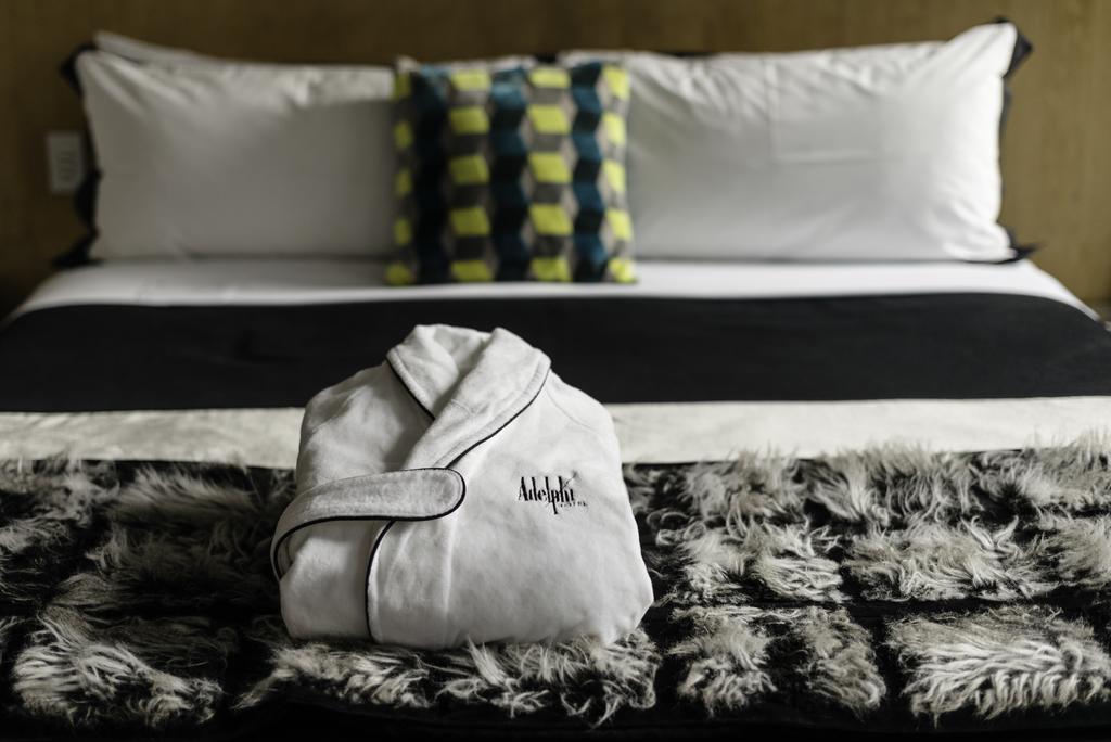 Adelphi Hotel Melbourne Bagian luar foto A bathrobe on a bed